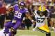 MINNEAPOLIS, MN - OCTOBER 27: Adrian Peterson #28 of the Minnesota Vikings gets pulled down while Jamari Lattimore #57 of the Green Bay Packers provides backup on October 27, 2013 at Mall of America Field at the Hubert Humphrey Metrodome in Minneapolis, Minnesota. (Photo by Adam Bettcher/Getty Images)