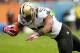 CHICAGO, IL - OCTOBER 06: Pierre Thomas #23 of the New Orleans Saints dives into the end zone to score a touchdown against the Chicago Bears at Soldier Field on October 6, 2013 in Chicago, Illinois. (Photo by Jonathan Daniel/Getty Images)