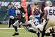 Nov 3, 2013; East Rutherford, NJ, USA; New York Jets running back Chris Ivory (33) scores a touchdown past New Orleans Saints outside linebacker David Hawthorne (57) in the first half during the game at MetLife Stadium. Mandatory Credit: Robert Deutsch-USA TODAY Sports