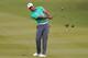 HAIKOU, CHINA - OCTOBER 28: Tiger Woods of the United States hits a shot on the seventh hole during his match against Rory McIlroy of Northern Ireland at Blackstone Course Mission Hills on October 28, 2013 in Haikou, China. (Photo by Lintao Zhang/Getty Images)