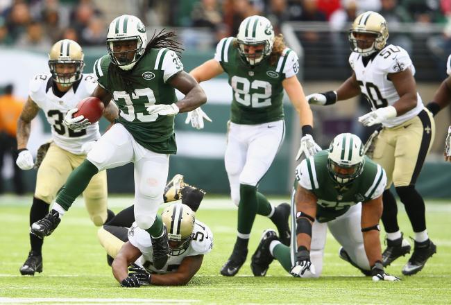 Hi-res-186717271-chris-ivory-of-the-new-york-jets-eludes-the-tackle-of_crop_north