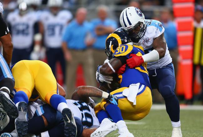 Hi-res-186727465-zach-brown-of-the-tennessee-titans-tackles-zac-stacy-of_crop_north