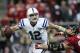 Nov 3, 2013; Houston, TX, USA; Indianapolis Colts quarterback Andrew Luck (12) looks for an open receiver during the second quarter as Houston Texans defensive end J.J. Watt (99) applies pressure at Reliant Stadium. Mandatory Credit: Troy Taormina-USA TODAY Sports