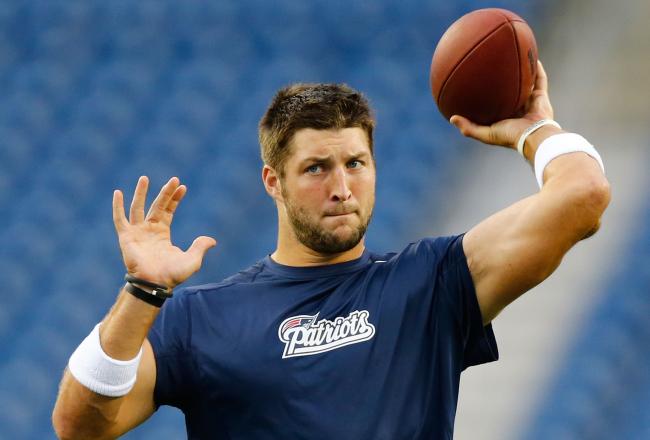 Hi-res-178346622-tim-tebow-of-the-new-england-patriots-warms-up-prior-to_crop_north