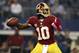 Oct 13, 2013; Arlington, TX, USA; Washington Redskins quarterback Robert Griffin III (10) throws a pass isn the first quarter against the Dallas Cowboys AT&T Stadium. Mandatory Credit: Tim Heitman-USA TODAY Sports