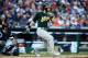 DETROIT, MI - OCTOBER 08: Josh Reddick #16 of the Oakland Athletics hits a double in the fourth inning against the Detroit Tigers during Game Four of the American League Division Series at Comerica Park on October 8, 2013 in Detroit, Michigan. (Photo by Leon Halip/Getty Images)