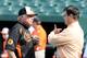 BALTIMORE, MD - AUGUST 16: Manager Buck Showalter #26 and General Manager Dan Duquette of the Baltimore Orioles talk before the game against the Colorado Rockies at Oriole Park at Camden Yards on August 16, 2013 in Baltimore, Maryland. (Photo by Greg Fiume/Getty Images)