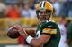 GREEN BAY, WI - AUGUST 09: Aaron Rodgers #12 of the Green Bay Packers participates in warm-ups before a game against the Arizona Cardinals at Lambeau Field on August 9, 2013 in Green Bay, Wisconsin. (Photo by Jonathan Daniel/Getty Images)