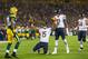 Nov 4, 2013; Green Bay, WI, USA; Chicago Bears wide receiver Brandon Marshall (15) celebrates a touchdown as Green Bay Packers cornerback Tramon Williams (38) looks on during the first quarter at Lambeau Field. Mandatory Credit: Jeff Hanisch-USA TODAY Sports