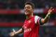 LONDON, ENGLAND - OCTOBER 19: Mesut Oezil of Arsenal celebrates as he scores their second goal during the Barclays Premier League match between Arsenal and Norwich City at the Emirates Stadium on October 19, 2013 in London, England. (Photo by Paul Gilham/Getty Images)