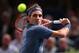 PARIS, FRANCE - NOVEMBER 02: Roger Federer of Switzerland in action against Novak Djokovic of Serbia during day six of the BNP Paribas Masters at Palais Omnisports de Bercy on November 2, 2013 in Paris, France. (Photo by Julian Finney/Getty Images)