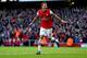 LONDON, ENGLAND - OCTOBER 19: Mesut Oezil of Arsenal celebrates as he scores their second goal during the Barclays Premier League match between Arsenal and Norwich City at Emirates Stadium on October 19, 2013 in London, England. (Photo by Paul Gilham/Getty Images)