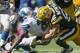 GREEN BAY, WI - OCTOBER 6: Clay Matthews #52 of the Green Bay Packers makes a tackle on Reggie Bush #21 of the Detroit Lions at Lambeau Field on October 6, 2013 in Green Bay, Wisconsin. (Photo Tom Lynn /Getty Images)