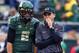 EUGENE, OR - OCTOBER 26: Head coach Mark Helfrich of the Oregon Ducks talks with quarterback Marcus Mariota #8 during pregame warm ups before the game against of the UCLA Bruins on October 26, 2013 at the Autzen Stadium in Eugene, Oregon. (Photo by Jonathan Ferrey/Getty Images)