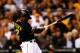 PITTSBURGH, PA - OCTOBER 01: Andrew McCutchen #22 of the Pittsburgh Pirates hits an infield single in the third inning against the Cincinnati Reds during the National League Wild Card game at PNC Park on October 1, 2013 in Pittsburgh, Pennsylvania. (Photo by Justin K. Aller/Getty Images)
