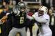 EUGENE, OR - NOVEMBER 17: Quarterback Marcus Mariota #8 of the Oregon Ducks eludes the rush of defensive tackle Terrence Stephens #99 of the Stanford Cardinal during the first quarter of the game at Autzen Stadium on November 17, 2012 in Eugene, Oregon. (Photo by Steve Dykes/Getty Images)