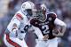 HOUSTON, TX - OCTOBER 19: Johnny Manziel #2 of the Texas A&M Aggies rushes past Gabe Wright #90 of the Auburn Tigers on October 19, 2013 at Kyle Field in College Station, Texas. Auburn Tigers won 45 to 41.(Photo by Thomas B. Shea/Getty Images)