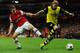 LONDON, ENGLAND - OCTOBER 22: Aaron Ramsey of Arsenal marshalls Marcel Schmelzer of Borussia Dortmund during the UEFA Champions League Group F match between Arsenal and Borussia Dortmund at Emirates Stadium on October 22, 2013 in London, England. (Photo by Shaun Botterill/Getty Images)