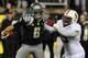 EUGENE, OR - NOVEMBER 17: Quarterback Marcus Mariota #8 of the Oregon Ducks eludes the rush of defensive tackle Terrence Stephens #99 of the Stanford Cardinal during the first quarter of the game at Autzen Stadium on November 17, 2012 in Eugene, Oregon. (Photo by Steve Dykes/Getty Images)