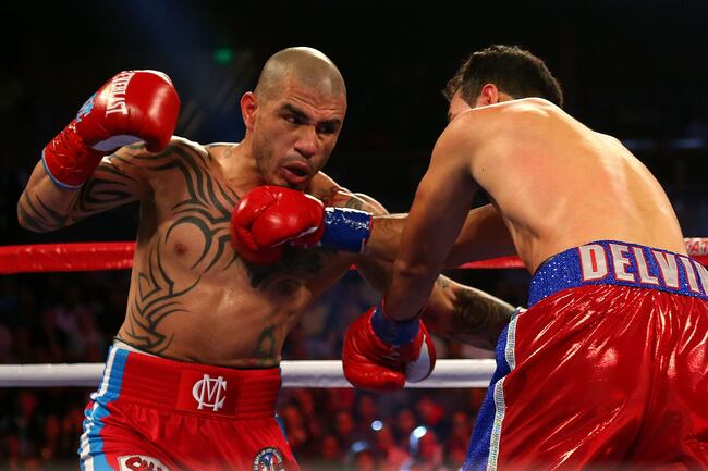 Hi-res-183201344-miguel-cotto-throws-a-punch-against-delvin-rodriguez_crop_north