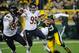 Nov 4, 2013; Green Bay, WI, USA; Green Bay Packers quarterback Seneca Wallace (9) is chased by Chicago Bears defensive end Julius Peppers (90) and defensive end Shea McClellin (99) in the 2nd quarter at Lambeau Field. Mandatory Credit: Benny Sieu-USA TODAY Sports