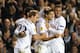 LONDON, ENGLAND - NOVEMBER 07: Erik Lamela of Spurs celebrates scoring their first goal with Kyle Walker and Christian Eriksen of Spurs during the UEFA Europa League Group K match between Tottenham Hotspur FC and FC Sheriff at White Hart Lane on November 7, 2013 in London, England. (Photo by Ian Walton/Getty Images)