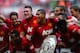 LONDON, ENGLAND - AUGUST 11: Phil Jones and Chris Smalling of Manchester United lead the celebrations with team mates after victory in the FA Community Shield match between Manchester United and Wigan Athletic at Wembley Stadium on August 11, 2013 in London, England. (Photo by Laurence Griffiths/Getty Images)