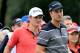 ANTALYA, TURKEY - NOVEMBER 07: Henrik Stenson of Sweden the European Tour's 'Race to Dubai' money on the tee at the par 3, second hole watched by Justin Rose of England during the first round of the 2013 Turkish Airlines Open on the Montgomerie Maxx Royal Course on November 7, 2013 in Antalya, Turkey. (Photo by David Cannon/Getty Images)