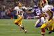 Nov 7, 2013; Minneapolis, MN, USA; Washington Redskins quarterback Robert Griffin III (10) runs away from Minnesota Vikings linebacker Marvin Mitchell (55) during the first quarter at Mall of America Field at H.H.H. Metrodome. Mandatory Credit: Brace Hemmelgarn-USA TODAY Sports