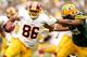 GREEN BAY, WI - SEPTEMBER 15: Jordan Reed #86 of the Washington Redskins carries the ball against Brad Jones #59 of the Green Bay Packers at Lambeau Field on September 15, 2013 in Green Bay, Wisconsin. (Photo by Matthew Stockman/Getty Images)