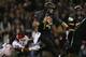 WACO, TX - NOVEMBER 07: Bryce Petty #14 of the Baylor Bears runs the ball past Eric Striker #19 of the Oklahoma Sooners at Floyd Casey Stadium on November 7, 2013 in Waco, Texas. (Photo by Ronald Martinez/Getty Images)
