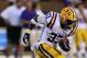 Oct 5, 2013; Starkville, MS, USA; LSU Tigers running back Jeremy Hill (33) advances the ball during the game against the Mississippi State Bulldogs at Davis Wade Stadium. Mandatory Credit: Spruce Derden-USA TODAY Sports