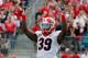 JACKSONVILLE, FL - NOVEMBER 02: Corey Moore #39 of the Georgia Bulldogs asks the crowd for noise during the game against the Florida Gators at EverBank Field on November 2, 2013 in Jacksonville, Florida. (Photo by Sam Greenwood/Getty Images)