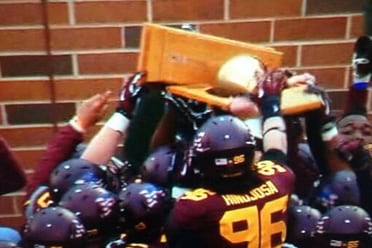 Gophers Excitedly Break Governor's Victory Bell Trophy