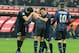 MILAN, ITALY - NOVEMBER 09: Yuto Nagatomo of FC Inter Milan (C) celebrates scoring the second goal during the Serie A match between FC Internazionale Milano and AS Livorno Calcio at San Siro Stadium on November 9, 2013 in Milan, Italy. (Photo by Claudio Villa/Getty Images)