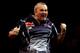 LONDON, ENGLAND - DECEMBER 30: Phil Taylor of England celebrates winning his semi final match against Raymond van Barneveld of the Netherlands on day fourteen of the 2013 Ladbrokes.com World Darts Championship at the Alexandra Palace on December 30, 2012 in London, England. (Photo by Ben Hoskins/Getty Images)