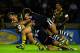 LONDON, ENGLAND - OCTOBER 24: Trent Waterhouse of Australia is hauled down by the New Zealand defence during the Gillette Four Nations Rugby League match between Australia and New Zealand at The Twickenham Stoop on October 24, 2009 in London, England. (Photo by Julian Finney/Getty Images)