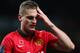 MANCHESTER, ENGLAND - NOVEMBER 10: Nemanja Vidic of Manchester United leaves the pitch after sustaining an injury during the Barclays Premier League match between Manchester United and Arsenal at Old Trafford on November 10, 2013 in Manchester, England. (Photo by Alex Livesey/Getty Images)