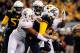 Nov 9, 2013; Morgantown, WV, USA; Texas Longhorns defensive end Jackson Jeffcoat (44) records a sack and forced fumble on West Virginia Mountaineers quarterback Paul Millard (14) at Milan Puskar Stadium. Mandatory Credit: Evan Habeeb-USA TODAY Sports