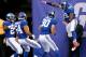 EAST RUTHERFORD, NJ - NOVEMBER 10: Cooper Taylor #30 of the New York Giants celebrates his touchdown with Allen Bradford #59 after Taylor scored with a blocked punt in the first quarter against the Oakland Raiders at MetLife Stadium on November 10, 2013 in East Rutherford, New Jersey. (Photo by Elsa/Getty Images)