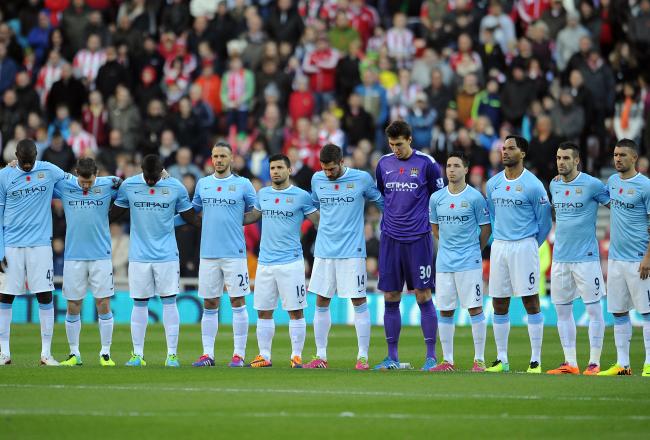 Hi-res-187569810-manchester-city-line-up-for-a-minutes-silence-during_crop_north