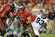 Oct 24, 2013; Tampa, FL, USA; Tampa Bay Buccaneers running back Brian Leonard (30) runs past Carolina Panthers outside linebacker Chase Blackburn (93) during the second quarter at Raymond James Stadium. Mandatory Credit: Steve Mitchell-USA TODAY Sports
