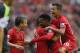 LIVERPOOL, ENGLAND - AUGUST 17: Daniel Sturridge of Liverpool is congratulated by Iago Aspas,Lucas,Philuppe Coutinho and Kolo Toure after scoring the first goal during the Barclays Premier League match between Liverpool and Stoke City at Anfield on August 17, 2013 in Liverpool, England. (Photo by Clive Brunskill/Getty Images)