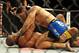 Jul 6, 2013; Las Vegas, NV, USA; Chris Weldman (blue shorts) and Anderson Silva during their Middleweight Chamionship Bout at the MGM Grand Garden Arena. Chris Weidman defeated Anderson in a TKO in the second round. Mandatory Credit: Jayne Kamin-Oncea-USA TODAY Sports