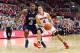 COLUMBUS, OH - NOVEMBER 9: Aaron Craft #4 of the Ohio State Buckeyes drives the ball past Cedric Blossom #34 of the Morgan State Bears during the second half at Value City Arena on November 9, 2013 in Columbus, Ohio. Ohio State defeated Morgan State 89-50. (Photo by Kirk Irwin/Getty Images)