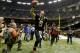 Nov 10, 2013; New Orleans, LA, USA; New Orleans Saints quarterback Drew Brees (9) celebrates as a runs off the field following a win over the Dallas Cowboys at Mercedes-Benz Superdome. The Saints defeated the Cowboys 49-17. Mandatory Credit: Derick E. Hingle-USA TODAY Sports