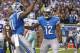DETROIT, MI - OCTOBER 27: Calvin Johnson #81 of the Detroit Lions celebrates with teammate Jeremy Ross #12 after scoring a first quarter touchdown during the game against the Dallas Cowboys at Ford Field on October 27, 2013 in Detroit, Michigan. (Photo by Leon Halip/Getty Images)