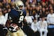 SOUTH BEND, IN - NOVEMBER 13: Clint Johnson #8 of the Notre Dame Fighting Irish runs with the ball during the game against the Florida State Seminoles at Notre Dame Stadium on November 13, 1993 in South Bend, Indiana. (Photo by Brian Masck/Getty Images)