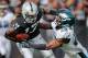 OAKLAND, CA - NOVEMBER 03: Safety Earl Wolff #28 of the Philadelphia Eagles brings down wide receiver Denarius Moore #17 of the Oakland Raiders on a 27-yard catch on the third play from scrimmage in the first quarter on November 3, 2013 at O.co Coliseum in Oakland, California. (Photo by Brian Bahr/Getty Images)