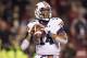 FAYETTEVILLE, AR - NOVEMBER 2: Nick Marshall #14 of the Auburn Tigers looks downfield for a reliever against the Arkansas Razorbacks at Razorback Stadium on November 2, 2013 in Fayetteville, Arkansas. The Tigers defeated the Razorbacks 35-17. (Photo by Wesley Hitt/Getty Images)